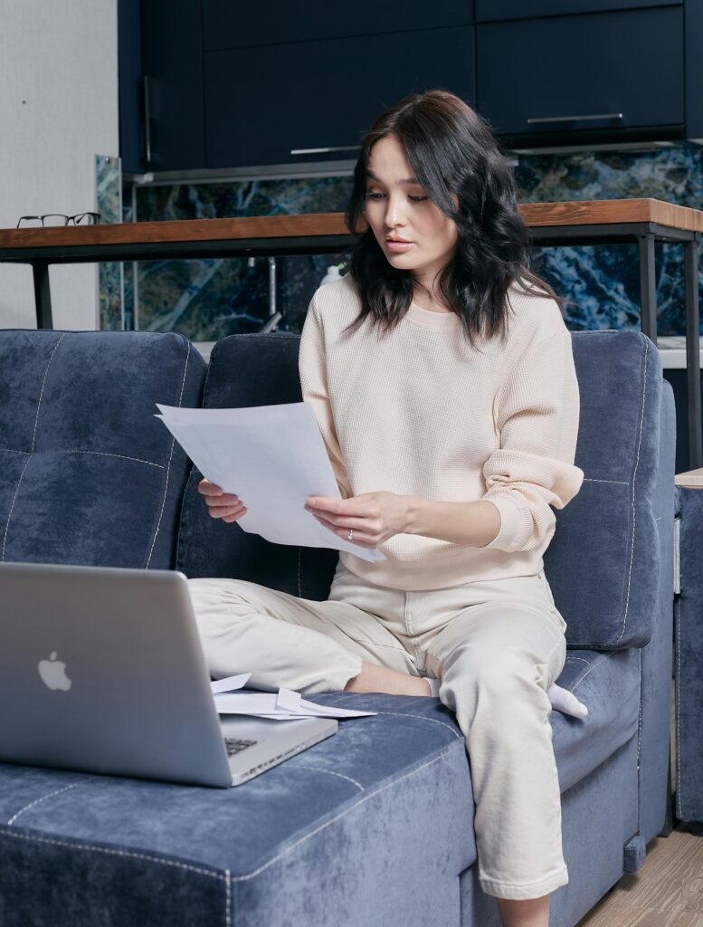 pexels-photo-6964082-6964082 A young woman in a cozy setting working from home on her laptop.